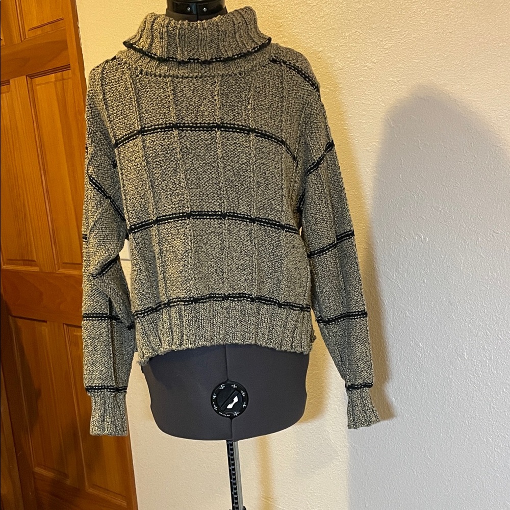 Elegant Black and Cream Turtleneck Sweater
